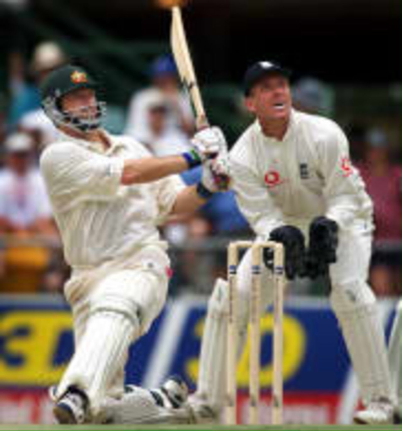 Steve Waugh lofts a boundary as Alec Stewart looks on The Ashes, 1998/99, 1st Test Australia v England Brisbane Cricket Ground, Woolloongabba, Brisbane 21 November 1998