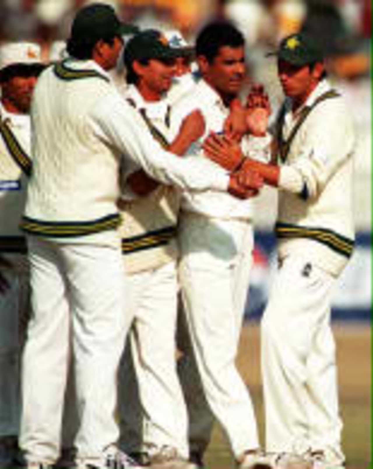 Pakistani players congratulate Waqar Younis after he dismisses Grant Flower Zimbabwe in Pakistan, 1998/99,  3rd One-Day International Pakistan v Zimbabwe Rawalpindi 24 November 1998