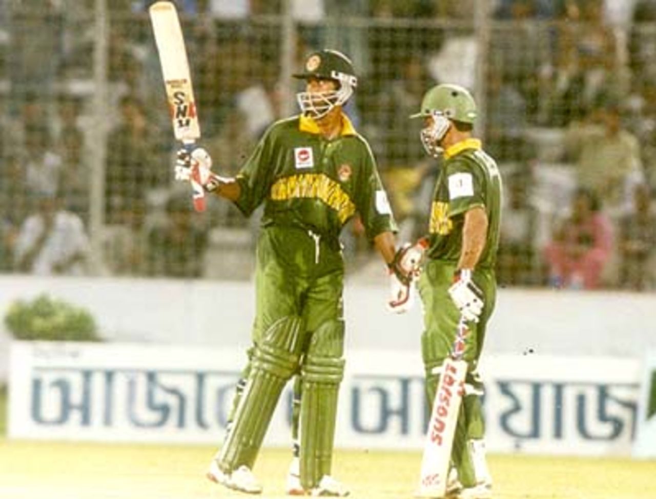 Al Shahriar Rokon acknowledges the crowd's cheers on reaching his fifty in the first ODI against West Indies, West Indies v Bangladesh (1st ODI) at Bangabandhu National Stadium, Dhaka 08 October 1999, West Indies in Bangladesh 1999/00