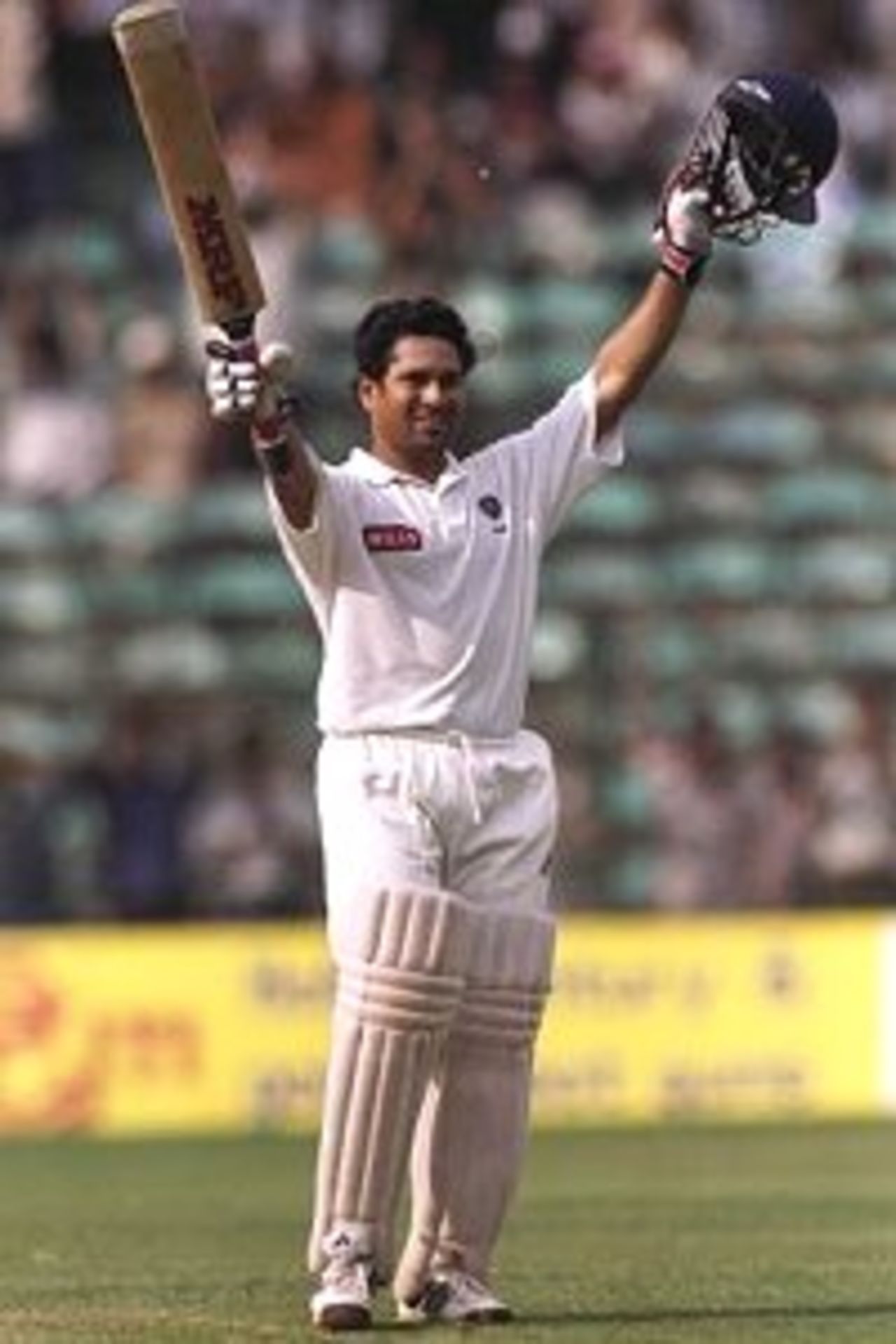 25 Mar 1998: Sachin Tendulkar of India celebrates reaching the century mark during the third test between India and Australia played in Bangalore, India. Australia won the match by 8 wickets even though India defeated them 2-1 in the 3-Test competition.