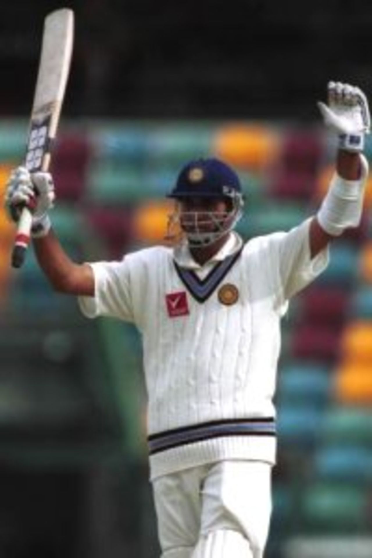 26 Nov 1999: Vangipuapu Venkata Sai Laxman of India celebrates scoring a century against Queensland at the Gabba cricket ground in Brisbane.