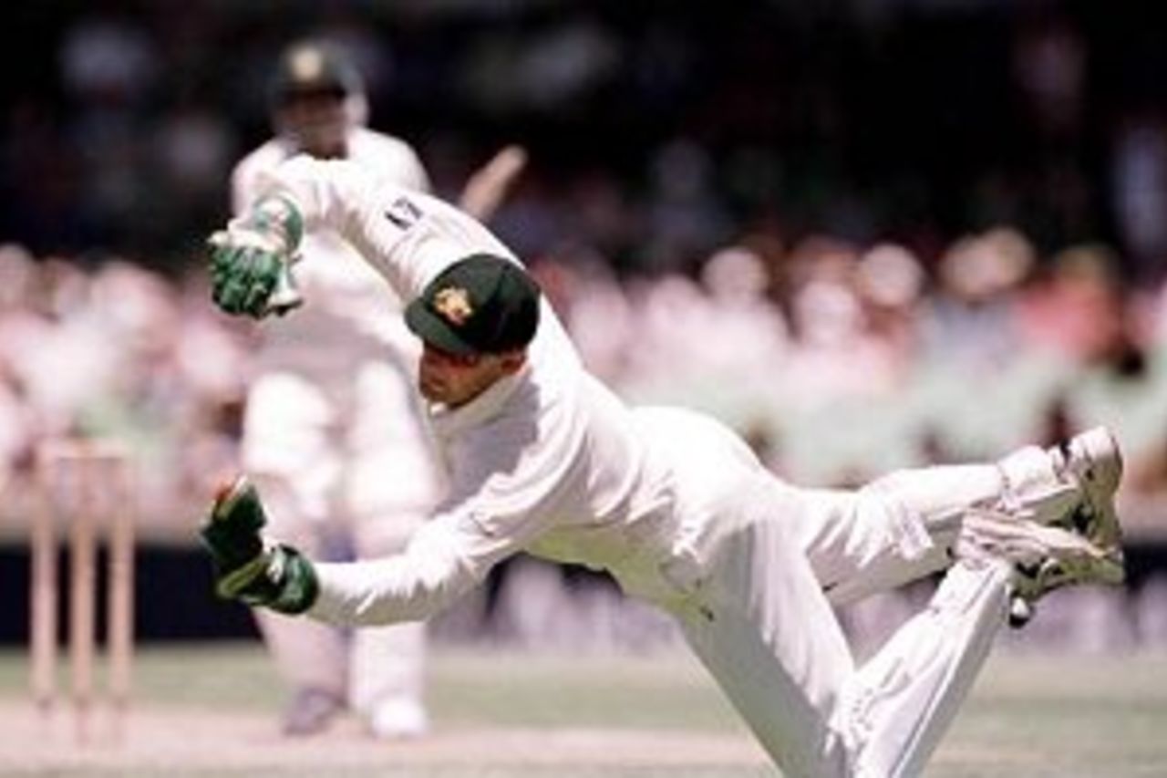 26 Nov 1999: Australian wicketkeeper Adam Gilchrist dives to his left to take a spectacular catch to dismiss Pakistan batsman Yousaf Youhana off the bowling of Glenn McGrath during day one of the third test played between Australia and Pakistan at the WACA ground in Perth, Western Australia, Australia.