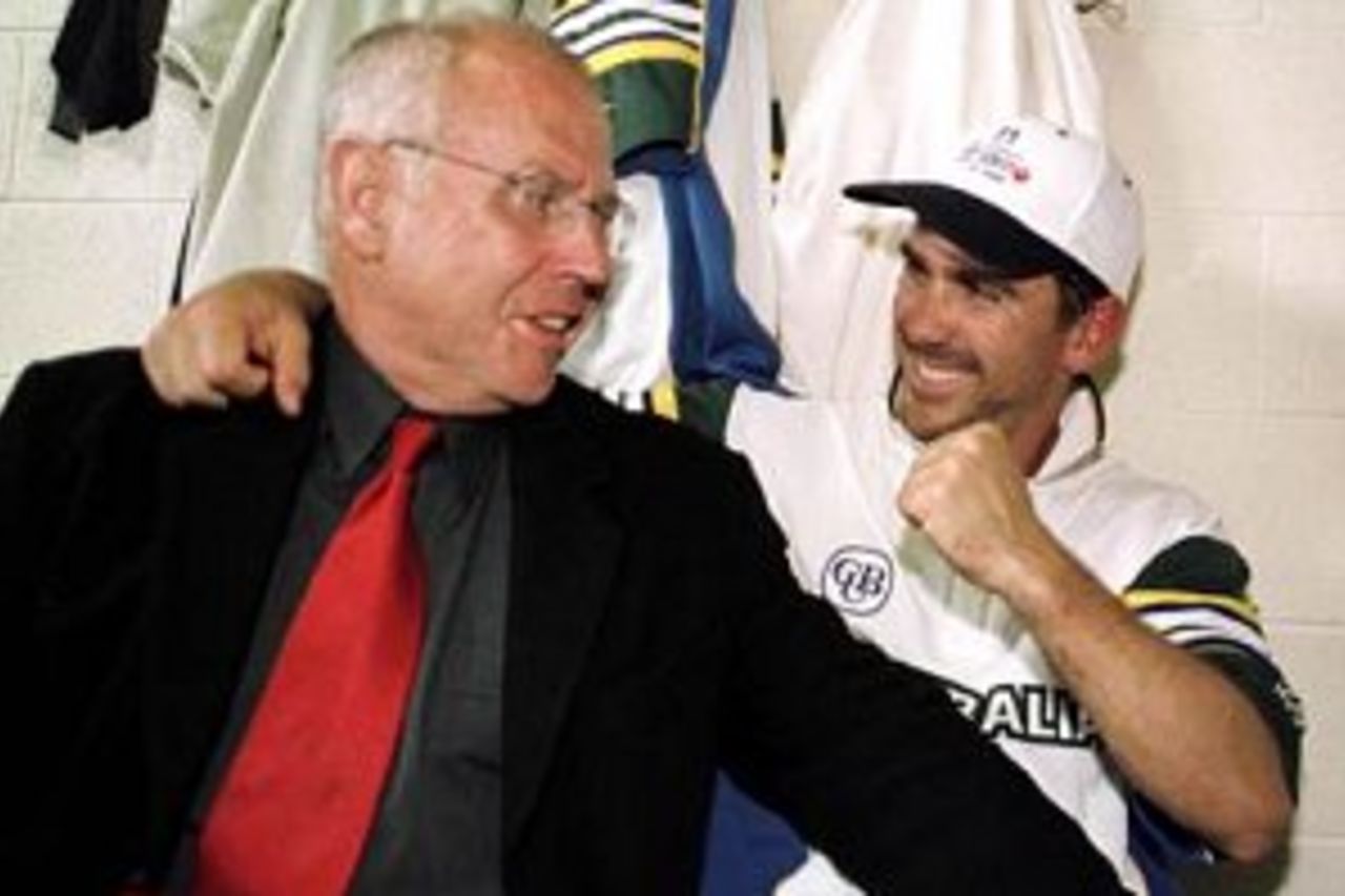 22 Nov 1999: Australian batsman Justin Langer (right) is congratulated by father Colin Langer after securing victory for Australia on day five of the Second test between Australia and Pakistan at Bellerive Oval, Hobart, Australia. Langer had earlier shared a partnership of 238 runs with Adam Gilchrist as Australia snatched victory by four wickets. Langer scored 129 runs and was named man of the match.