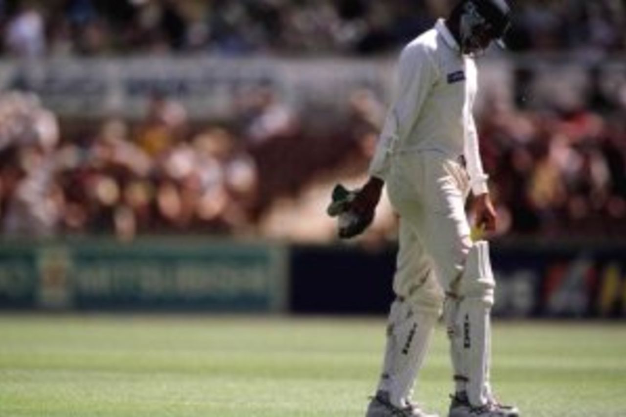 28 Nov 1999: Pakistan captain Wasim Akram trudges from the ground after being dismissed off the bowling of Michael Kasprowicz. Later, Australia took out the series 3 - 0 series over Pakistan on day three of the third test played between Australia and Pakistan at the WACA ground in Perth, Western Australia, Australia.