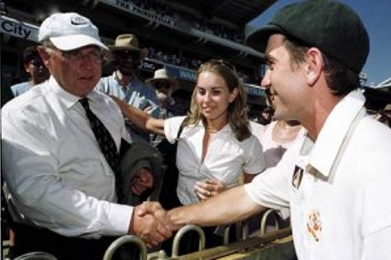 28 Nov 1999: Australia's Justin Langer, named Player of the Series is congratulated by his father, Colin as sister Jemma looks on following Australia's 3 - 0 series win over Pakistan on day three of the third test played between Australia and Pakistan atthe WACA ground in Perth, Western Australia, Australia.