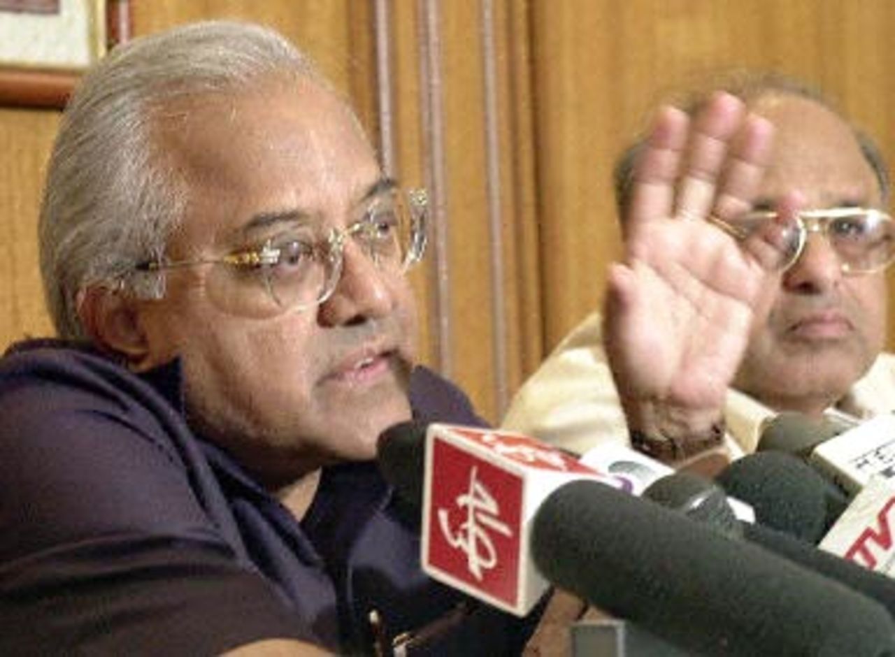 A.C. Muthiah (L) president of Board of Control for Cricket in India (BCCI) gestures as he announces the appointment of former New Zealand cricketer John Wright as the new coach for the Indian cricket team,as an unidentified cricket official (R) looks on at a press conference in Bombay 02 November 2000. While speaking to journalists Mutaiah also said that BCCI will not spare any persons involved in the match-fixing controversy. Muthiah left later 02 November for New Delhi for a meeting with Indian Sports Minister S.S. Dhindsa 03 November regarding the report released by India's Central Bureau of Investagiton (CBI) indicting several top international cricketeers in the match-fixing controversy.