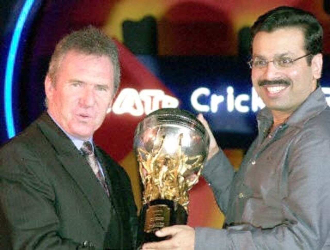 Allan Border (L) selector Australian Cricket Board, receives the CEAT International award for the best team for the year 1999-2000, on behalf of the Australian skipper Steve Waugh, from is Sanjeev Goenka, an industrialist, 03 November 2000, in south Bombay. This is the second time that Australia has won the coveted award.