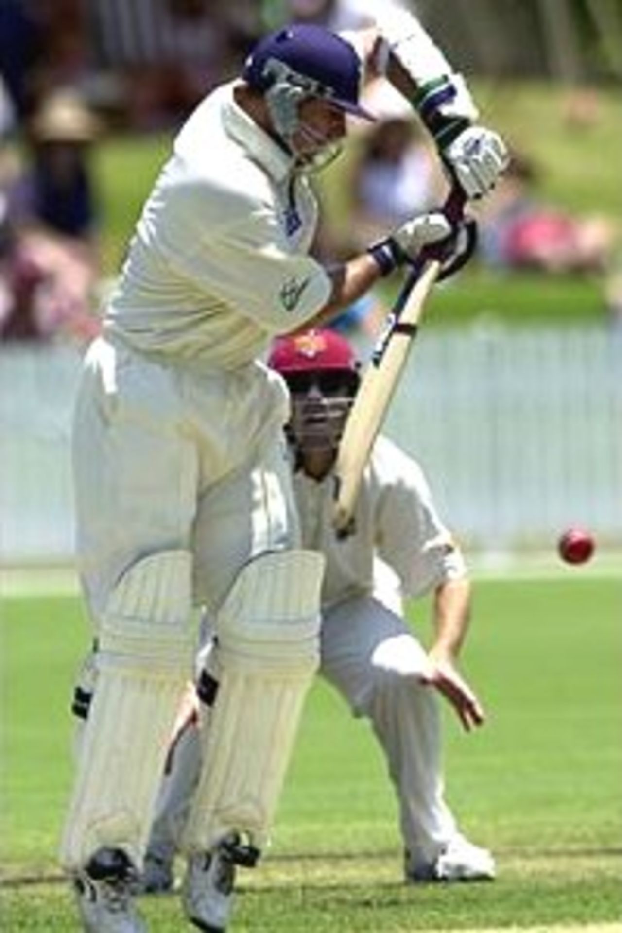05 Nov 2000: Jason Arnberger of Victoria in action while Matthew Anderson of Queensland looks on during the Pura Cup match between Queensland and Victoria played at Allan Border Field in Brisbane, Australia.