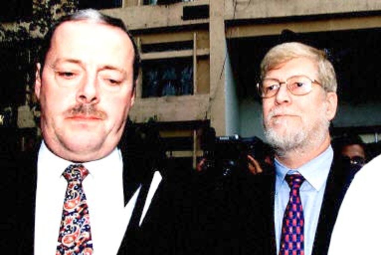 Martin Hawkins (L) and Alan Peacock, investigators from the International Cricket Council's anti-corruption wing, come out after meeting detectives of the Central Bureau of Investigation in New Delhi, 04 November 2000. They are here for details on match fixing charges also levelled against English cricketer Alec Stewart and eight other foreign players.
