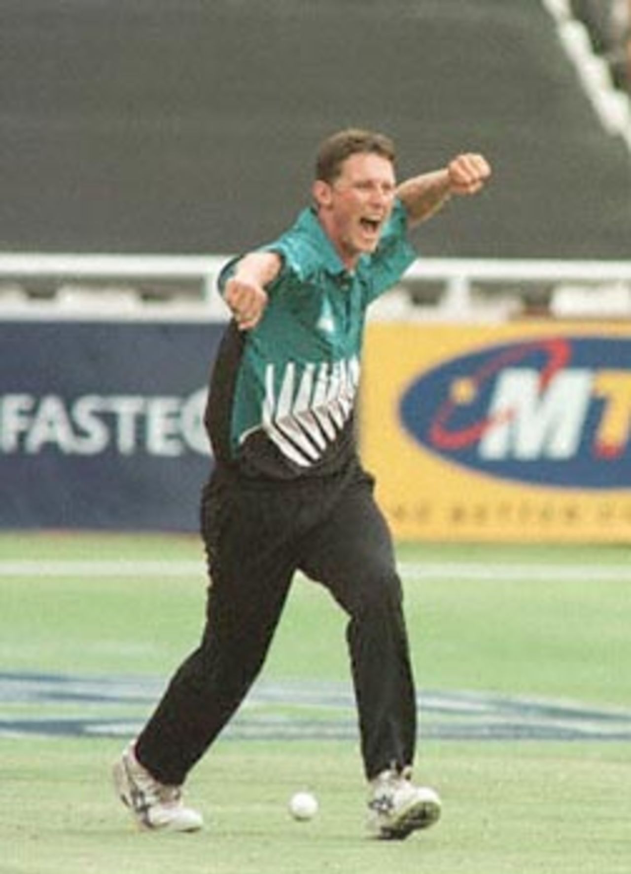 Shayne O'Connor pumps his fist after picking up Kallis. New Zealand in South Africa 2000/01, 6th One-Day International, South Africa v New Zealand, Newlands, Cape Town, 04 November 2000