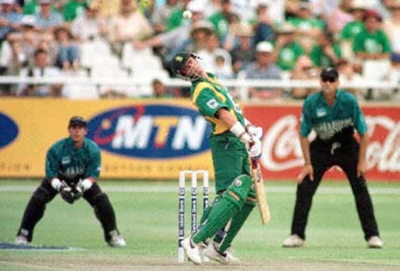 Boje evades a bouncer as skipper fleming and Parore look on. New Zealand in South Africa 2000/01, 6th One-Day International, South Africa v New Zealand, Newlands, Cape Town, 04 November 2000