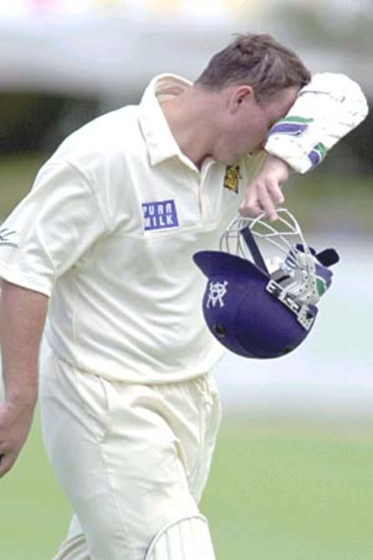 05 Nov 2000: Jason Arnberger of Victoria shows his disappointment after getting out for 64 runs off the bowling of Joe Dawes of Queensland during the Pura Cup match between Queensland and Victoria played at Allan Border Field in Brisbane, Australia.