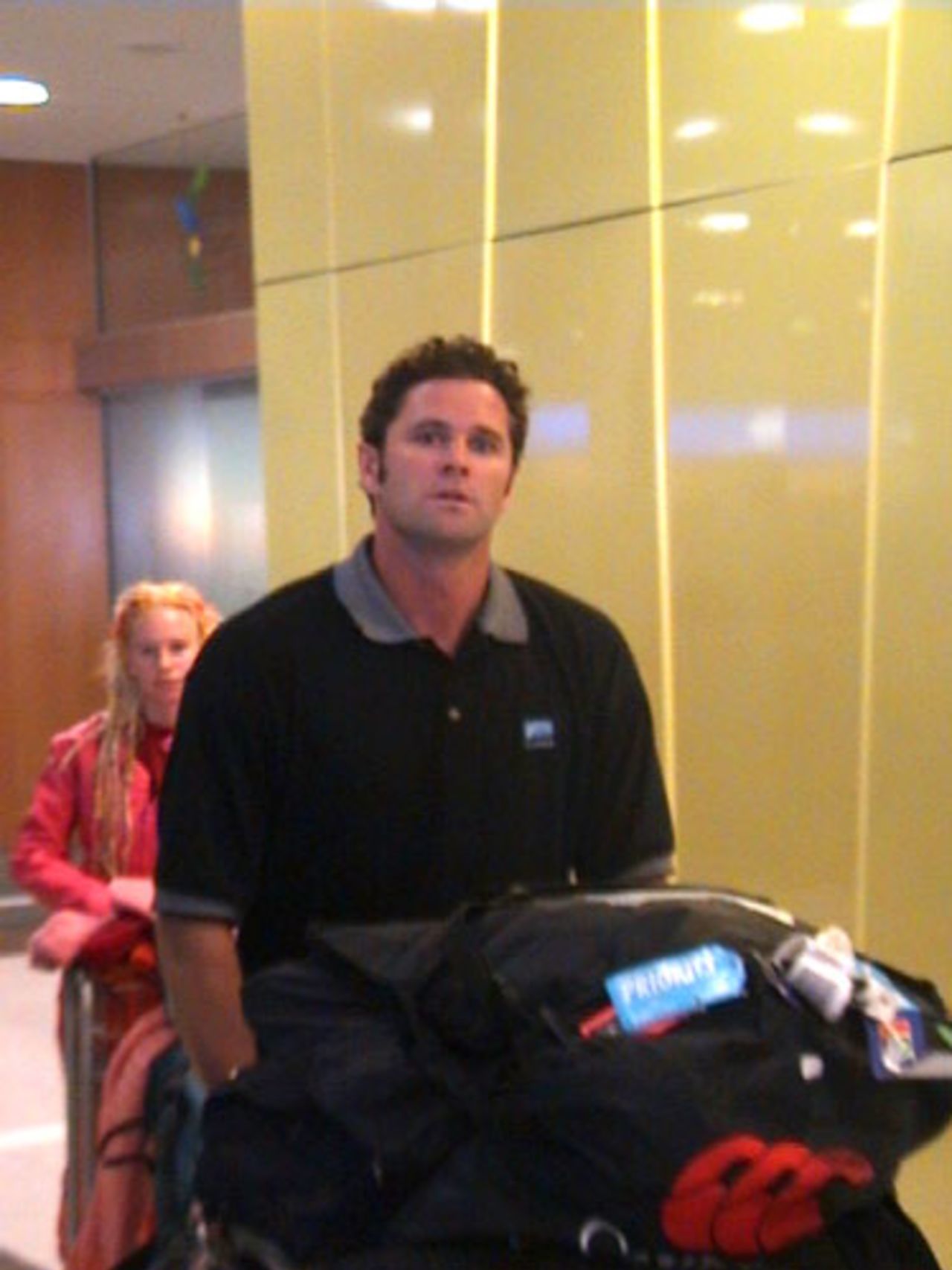 Injured New Zealand all-rounder Chris Cairns arrives at Christchurch International Airport from South Africa, 7 November 2000