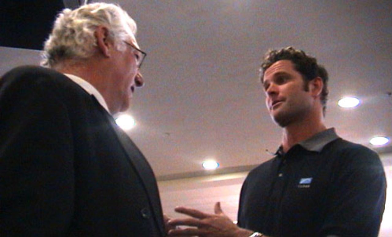 Injured New Zealand all-rounder Chris Cairns talks to New Zealand Cricket chief executive Christopher Doig upon arriving at Christchurch International Airport from South Africa, 7 November 2000