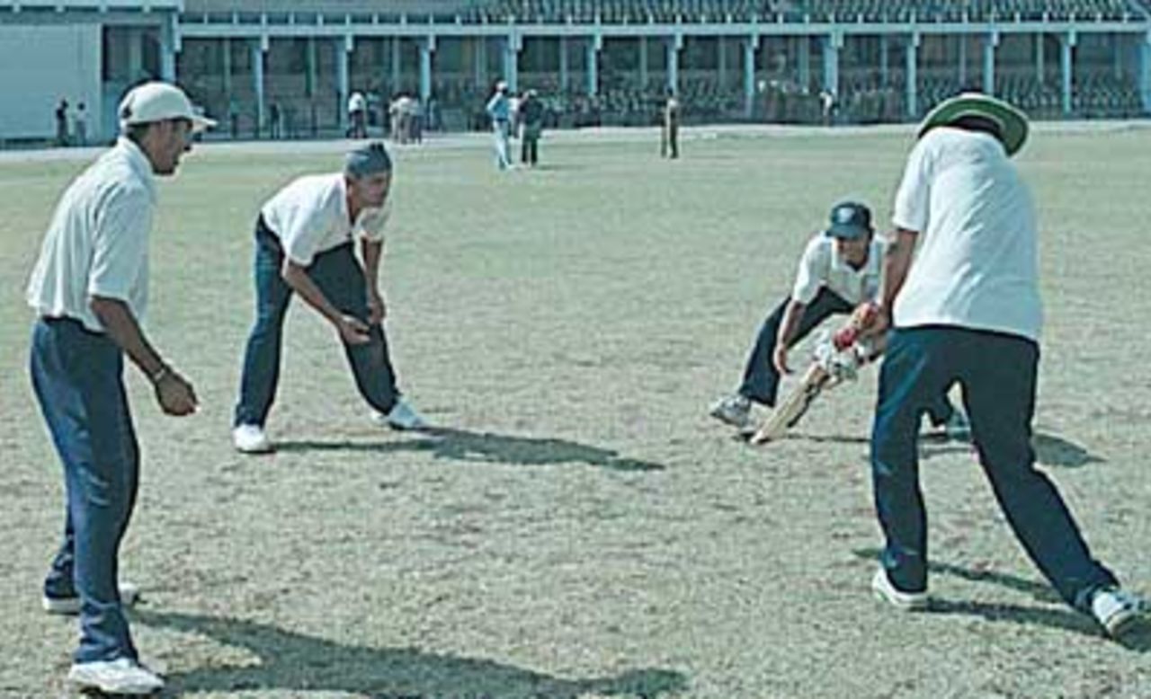 Rakesh Patel giving catch practice to Sodhi, Doru and Gambhir, (National Cricket Academy XI team), Zimbabwe in India, Nehru Stadium Indore, 07 November 2000