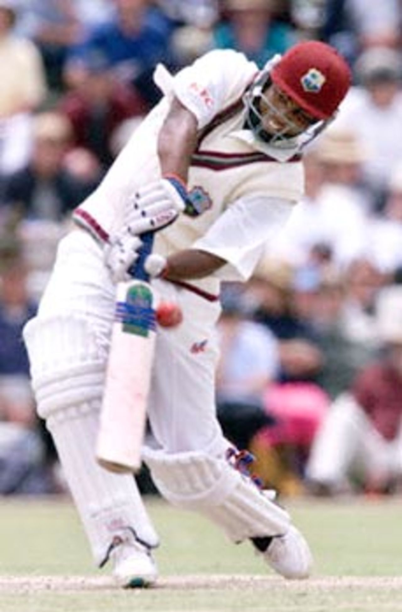 Batsman Brian Lara lifts the ball for six runs off bowler Stuart Karppinen during an exhibition match at Lilac Hill near Perth, 07 November 2000. The match is being played between the West Indies test side and the Australian Cricket Board Chairman's X1 and is the touring sides first official fixture. Lara was out for 108 runs, including three six and eleven fours.