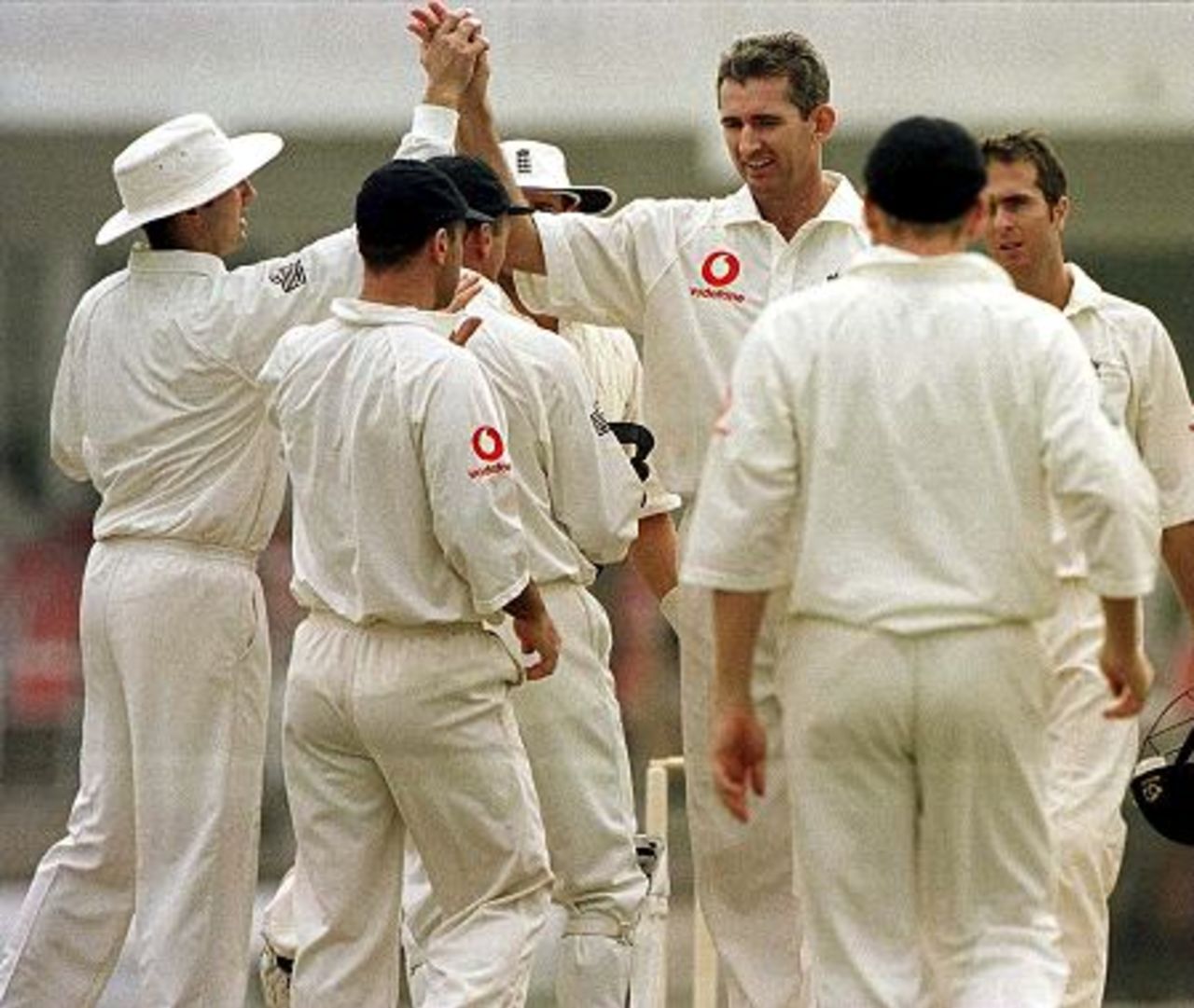 8 Nov 2000: Andrew Caddick of England is congratulated by teammates after taking the wicket of Taufeeq during the Governors XI v England 4 day warm up game at the Shahi Bagh Stadium, Peshawar, Pakistan.