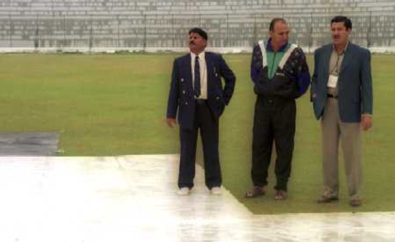 Umpires observing the pitch after the rain, Governor's XI v England XI at Peshawar, 8-11 Nov 2000