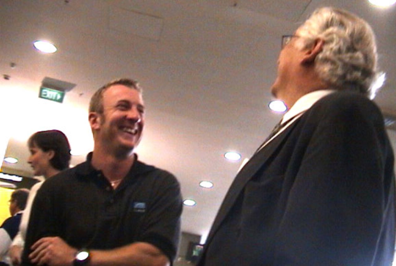 New Zealand wicket-keeper/batsman Chris Nevin laughs with New Zealand chief executive Christopher Doig upon arriving at Christchurch International Airport from South Africa, 7 November 2000