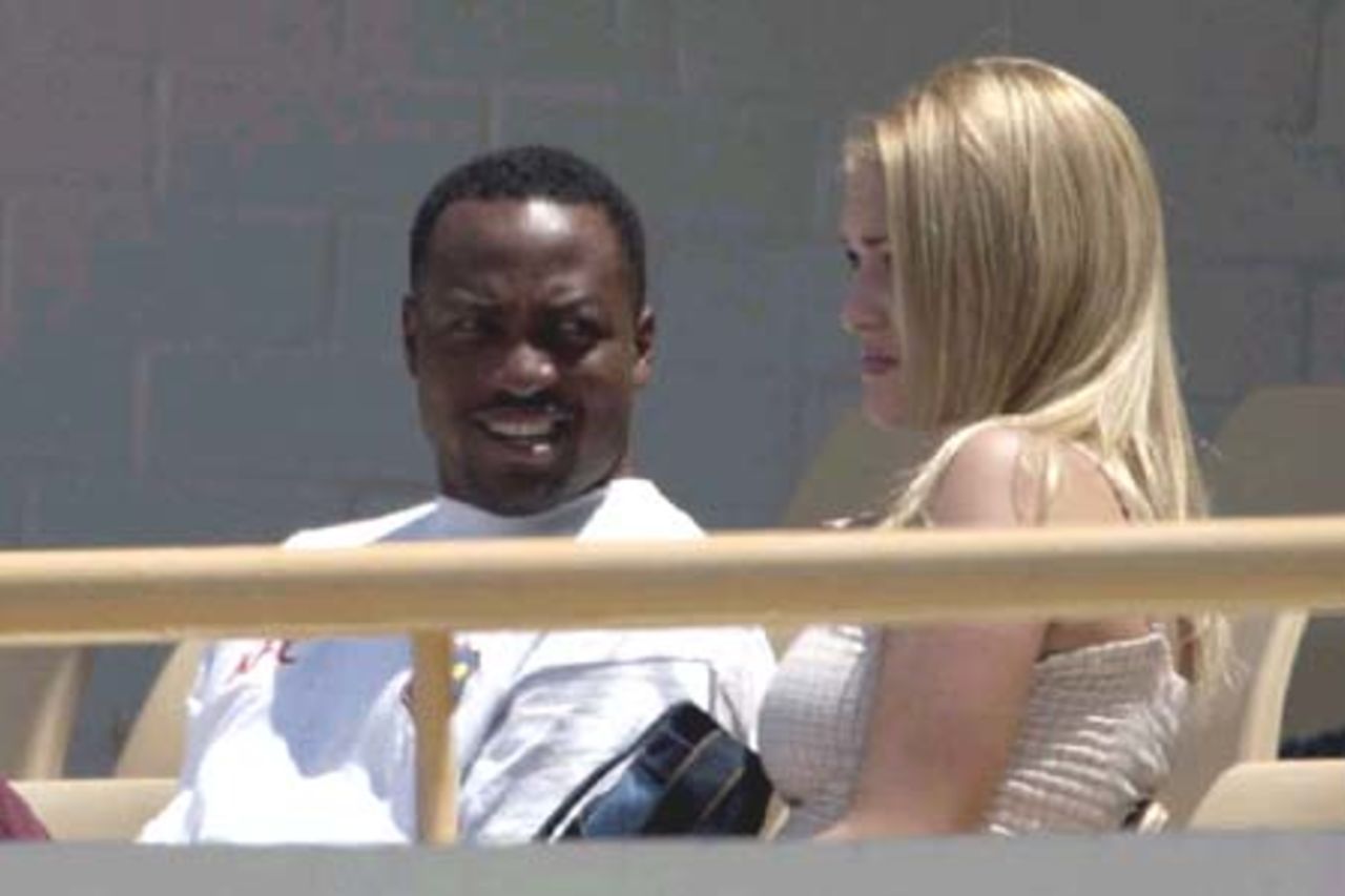 10 Nov 2000: Brian Lara,for the West Indies with Lindsay Ward watching the match between the Western Warriors and the West Indies at the WACA ground in Perth, Australia.