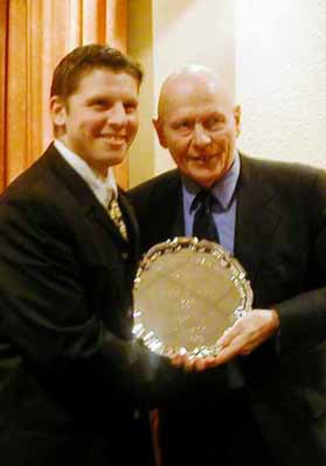 Roger Miller (Andover) receives the Division 1 batting award from Wilf McGuinness (Manchester United)
