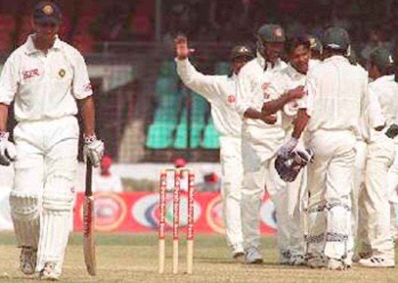 A overjoyed Mohammad Rafique after picking up the wicket of Dravid. India in Bangladesh 2000/01, Only Test, Bangladesh v India, Bangabandhu National Stadium, Dhaka, 10-14 Nov 2000 (Day 3)