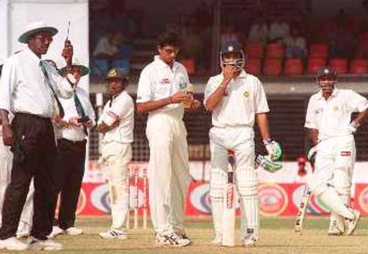 An anxious looking Karim and Ganguly waiting for the third umpires' signal. India in Bangladesh 2000/01, Only Test, Bangladesh v India, Bangabandhu National Stadium, Dhaka, 10-14 Nov 2000 (Day 3)