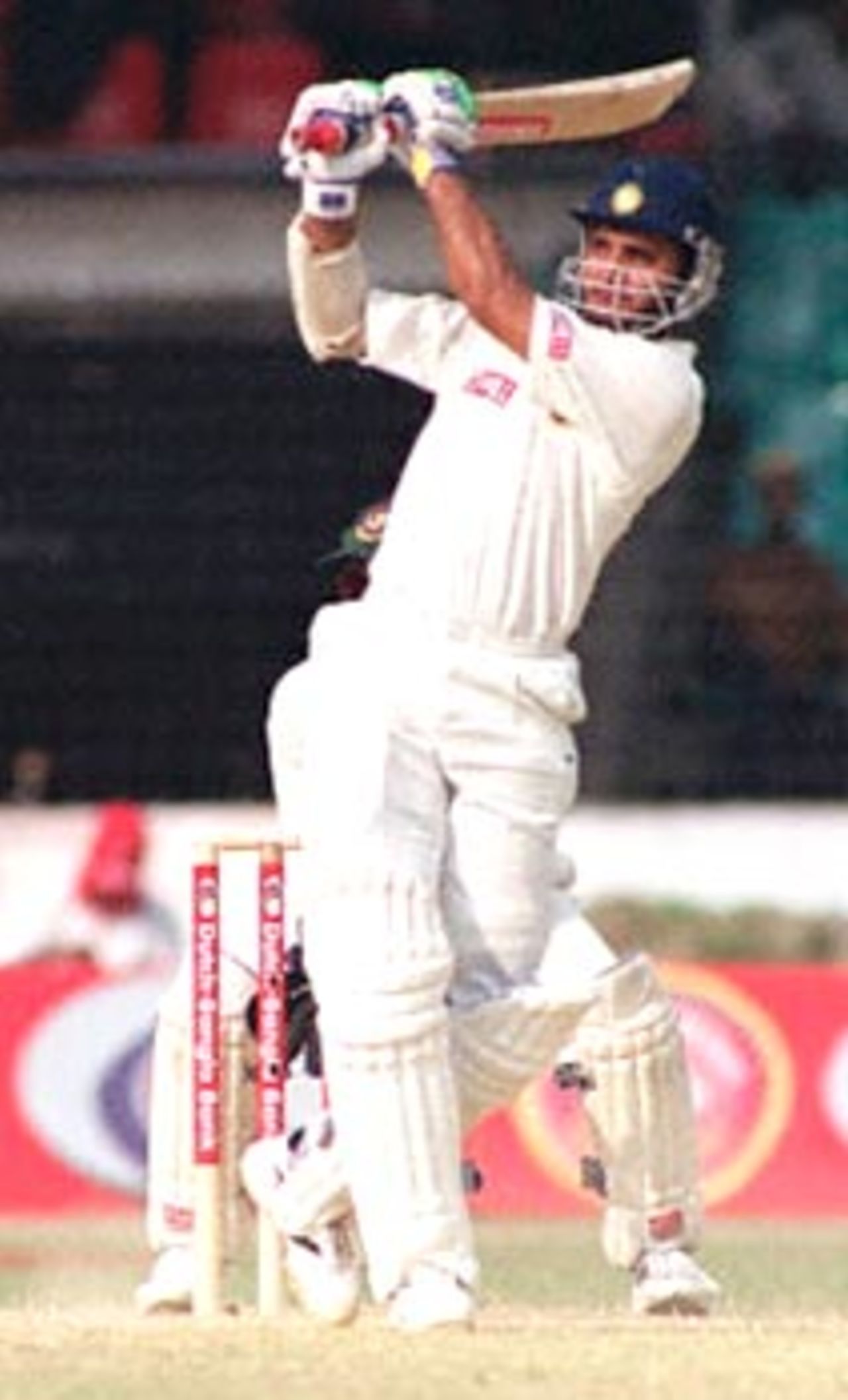 Indian skipper Sourav Ganguly hits a boundary off his Bangladeshi counterpart Naimur Rhaman (not in picture) 12 November 2000 at the Bangabandhu National Stadium on the third day of this South Asian country's inaugural Test match against India. Sourav hit 84 before being caught out by Al-Shariar off Namiur. India scored 366 for 7 wickets after the third day's play.