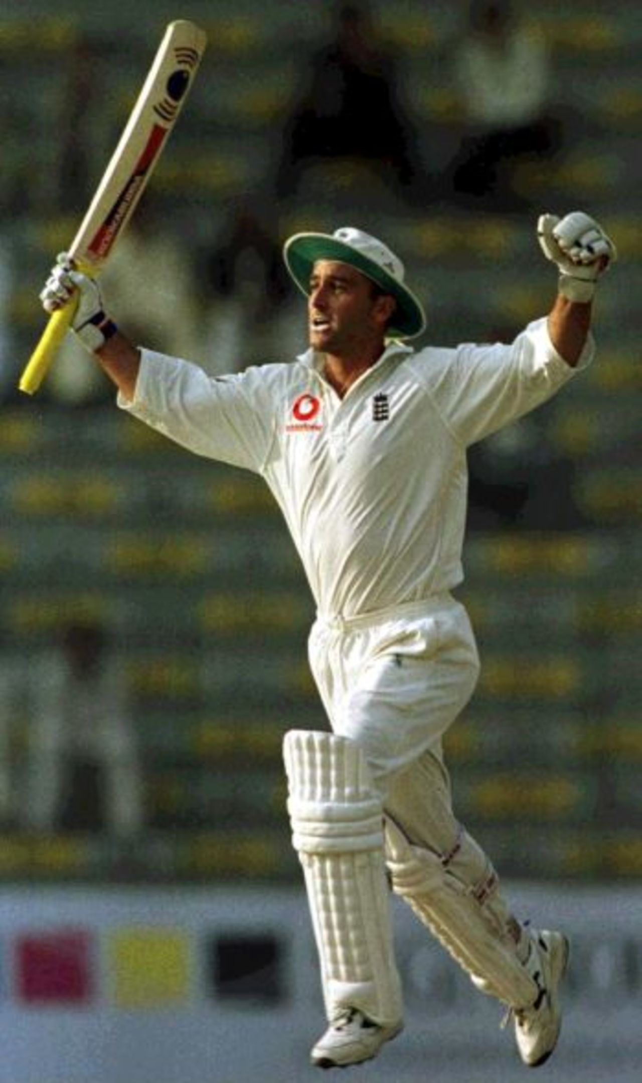 16 Nov 2000: Graham Thorpe of England celebrates scoring a century during the 2nd days play in the first Test match at between Pakistan and England at the Gaddafi stadium in Lahore, Pakistan.