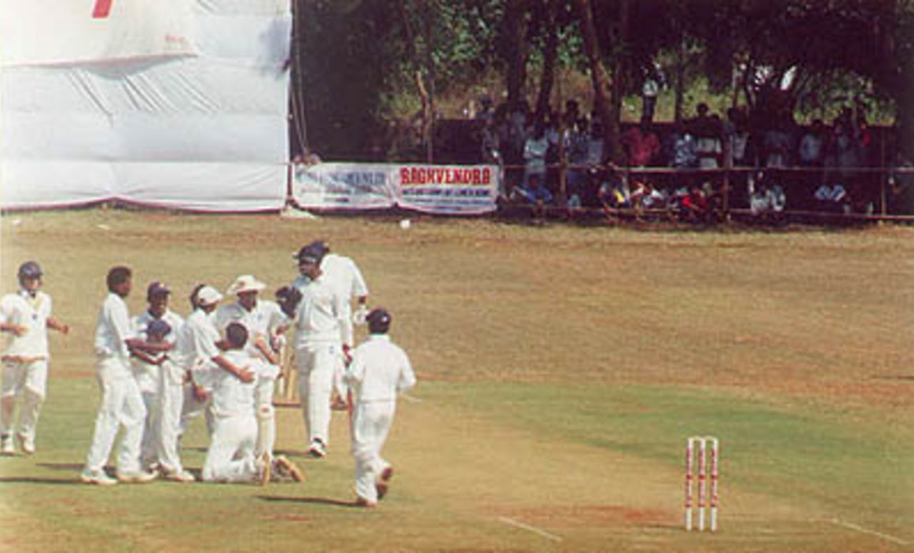 Shahbuddin being congratulated by team members after Ganesh got out, Ranji Trophy South Zone League, 2000/01, Karnataka v Andhra, Union Gymkhana Ground, Belgaum, 15-18 November 2000 (Day 2).