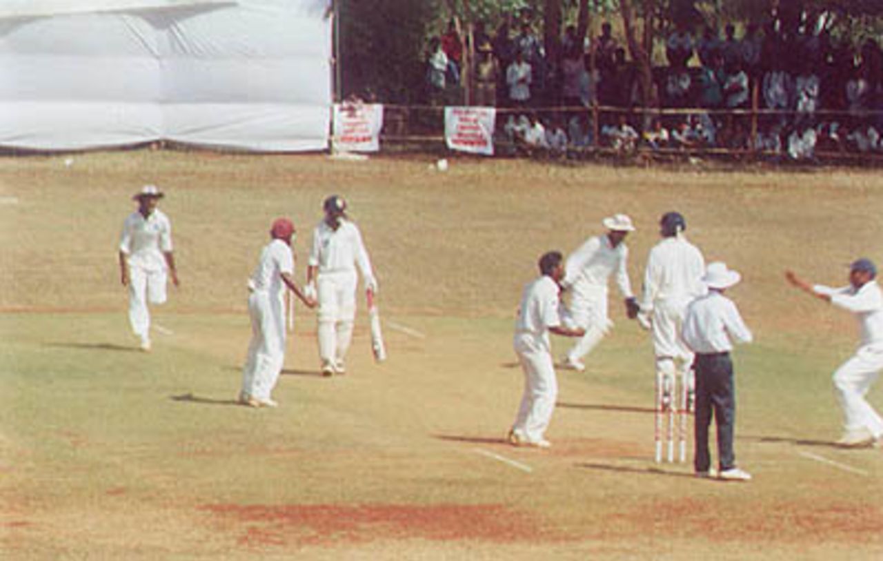 Andhra players enjoying the dismissal of Mithun Beerala, Ranji Trophy South Zone League, 2000/01, Karnataka v Andhra, Union Gymkhana Ground, Belgaum, 15-18 November 2000 (Day 3).