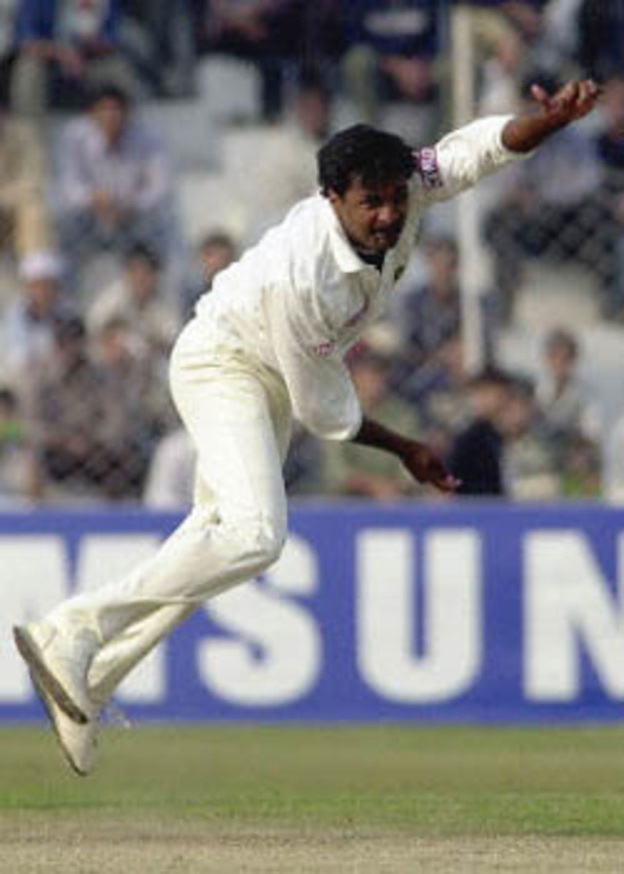 Indian pace bowler Javagal Srinath follows through on the first day of the first cricket Test match between India and Zimbabwe. Srinath took three wickets for India to restrict Zimbabwe to 232 for 5 wickets at the end of the day's play. Zimbabwe in India, 2000/01, 1st Test, India v Zimbabwe, Feroz Shah Kotla, Delhi, 18-22 November 2000 (Day 1).