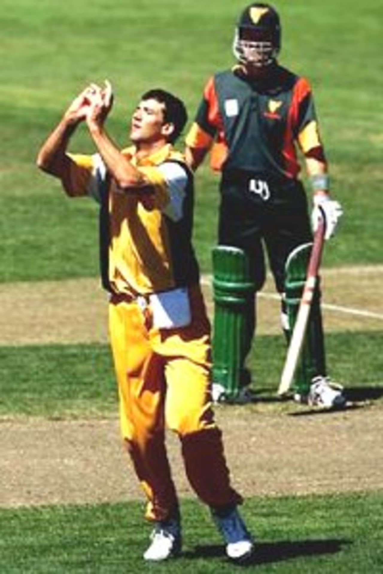 18 Nov 2000: Jo Angel from Western Australia takes the wicket (caught and bowled) of Michael DiVenuto from Tasmania during the Mercantile Mutual Cup Cricket match between Tasmania and Western Australia at Bellerive Oval in Hobart, Australia