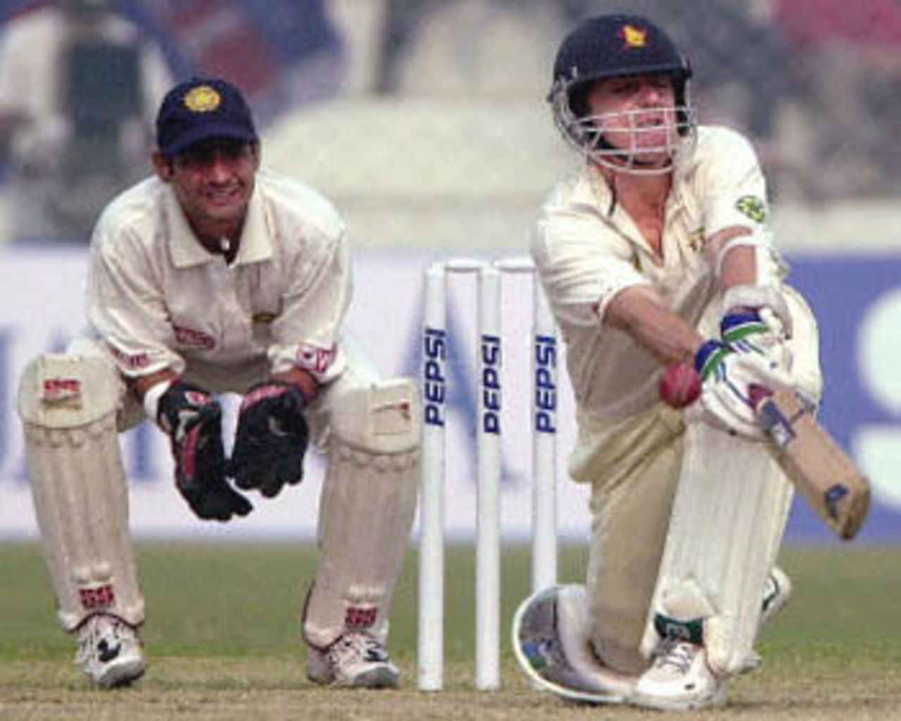 Paul Strang tries to sweep the ball as Dahiya looks on, Zimbabwe in India, 2000/01, 1st Test, India v Zimbabwe, Feroz Shah Kotla, Delhi, 18-22 November 2000 (Day 2).