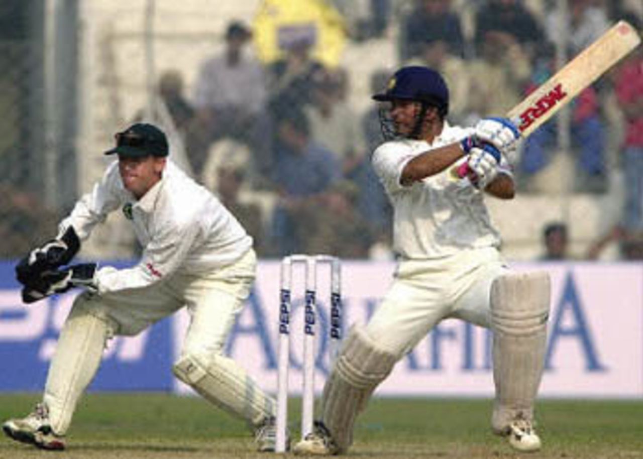 Sachin Tendulkar cuts the ball to the boundary as Flower looks on, Zimbabwe in India, 2000/01, 1st Test, India v Zimbabwe, Feroz Shah Kotla, Delhi, 18-22 November 2000 (Day 4).