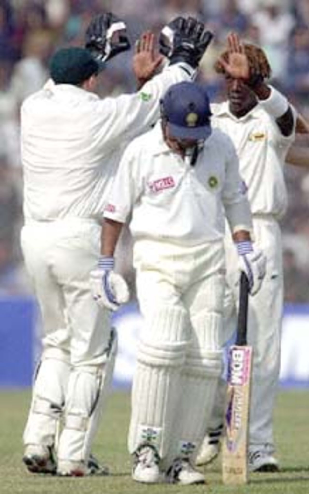 Flower congratulates Olonga on picking up the wicket of SS Das. Zimbabwe in India 2000/01, 1st Test, India v Zimbabwe Feroz Shah Kotla, Delhi, 18-22 November 2000 (Day 3)