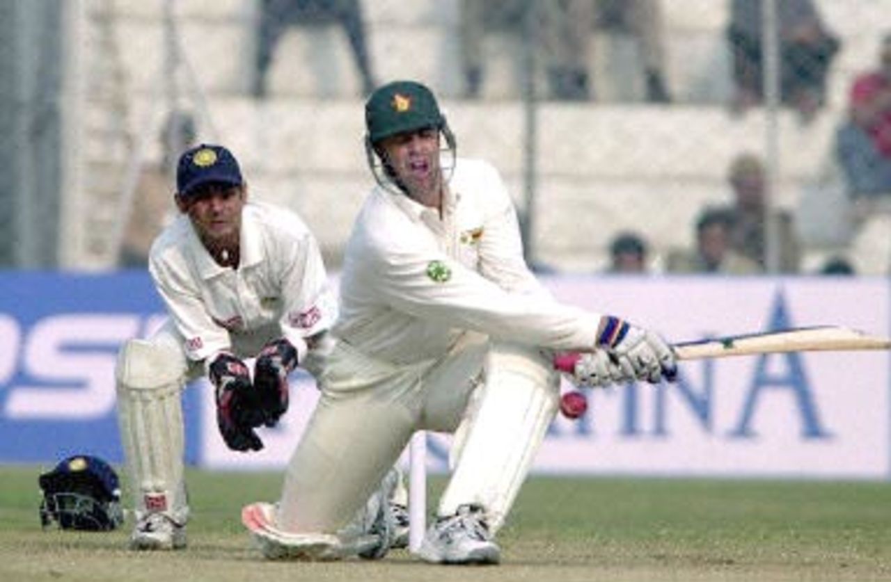 Zimbabwean skipper Streak sweeps the ball. Zimbabwe in India 2000/01, 1st Test, India v Zimbabwe Feroz Shah Kotla, Delhi, 18-22 November 2000 (Day 5)