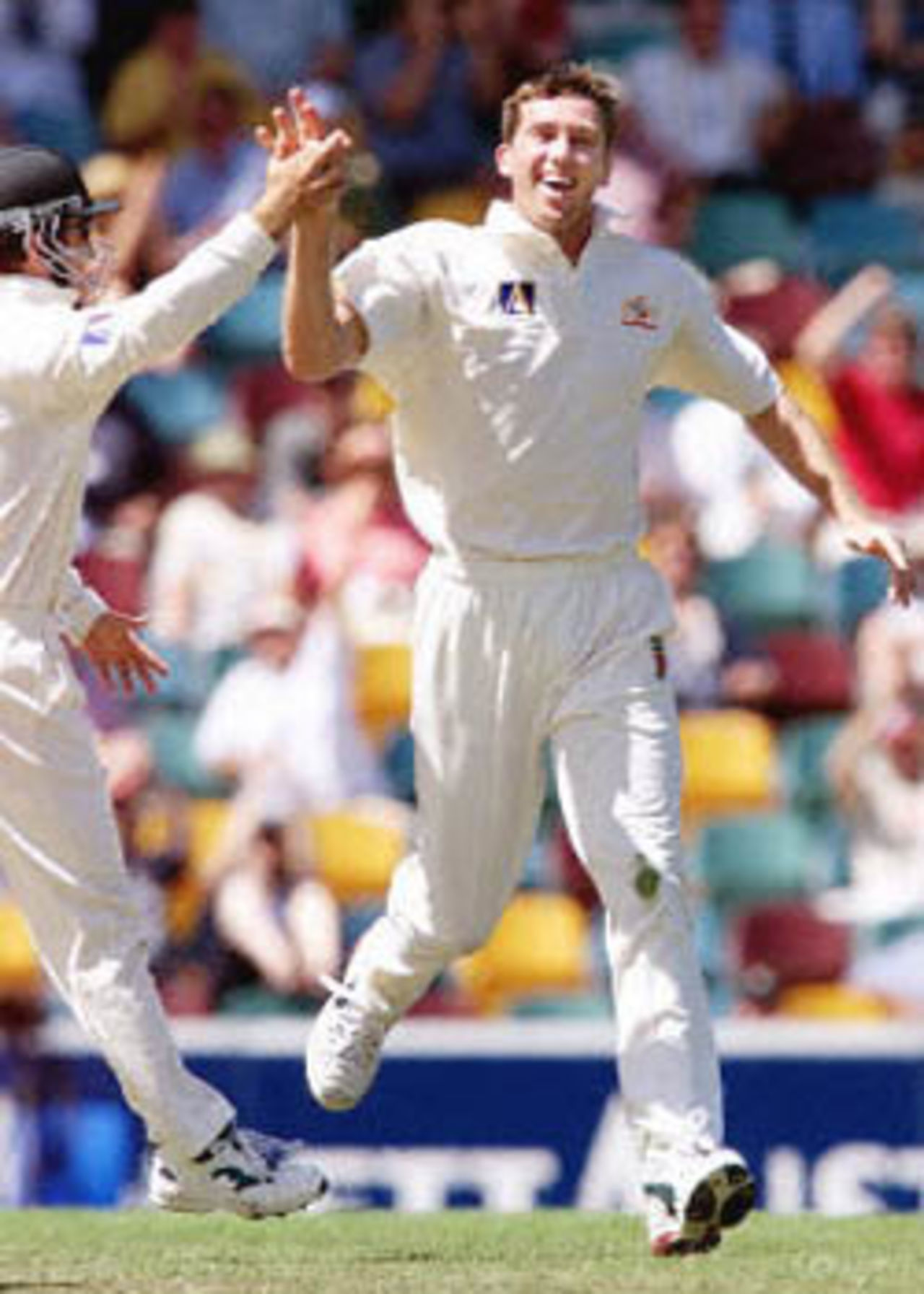 McGrath celebrates a West Indian wicket with Justin Langer, The Frank Worrell Trophy, 2000/01, 1st Test, Australia v West Indies, Brisbane Cricket Ground, Woolloongabba, Brisbane, 23-27 November 2000 (Day 1).