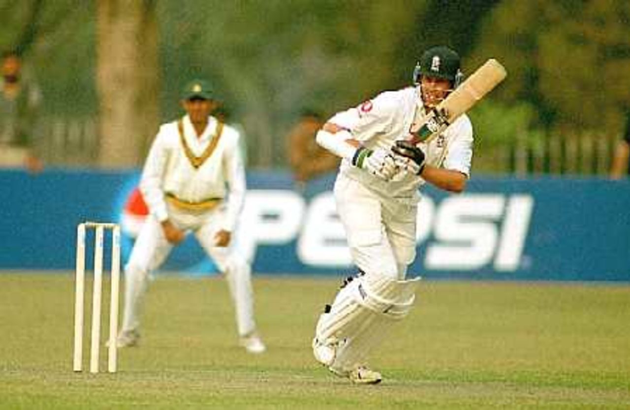 Trescothick following the ball after driving it towards leg, England v PCB XI at Lahore, 23-25 Nov 2000
