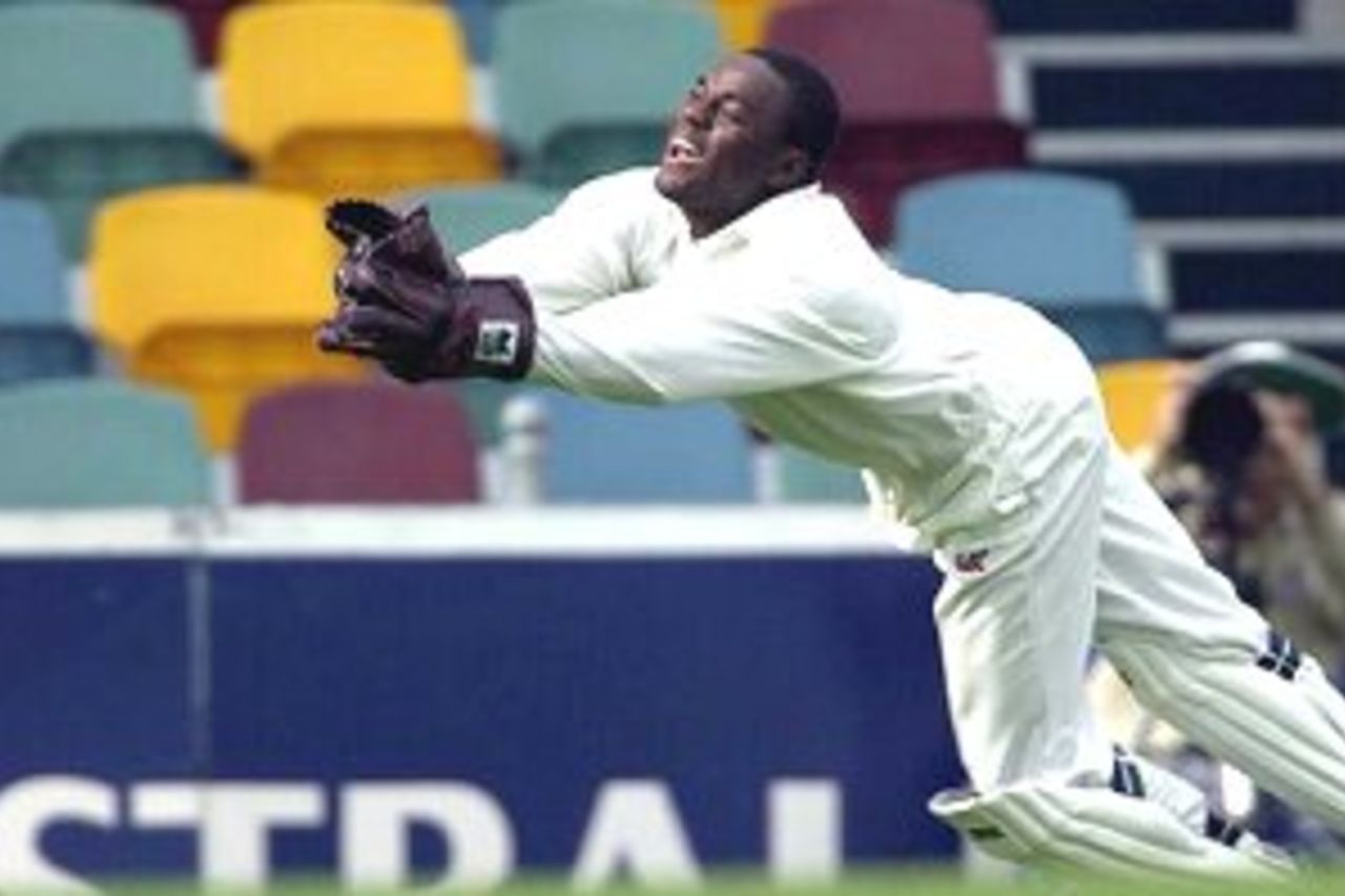 24 Nov 2000: Ridley Jacobs of West Indies catches Adam Gilchrist of Australia off the bowling of Mervyn Dillon for 48 during the second day of the First Test match between Australia and West Indies at The Gabba cricket ground in Brisbane, Australia.