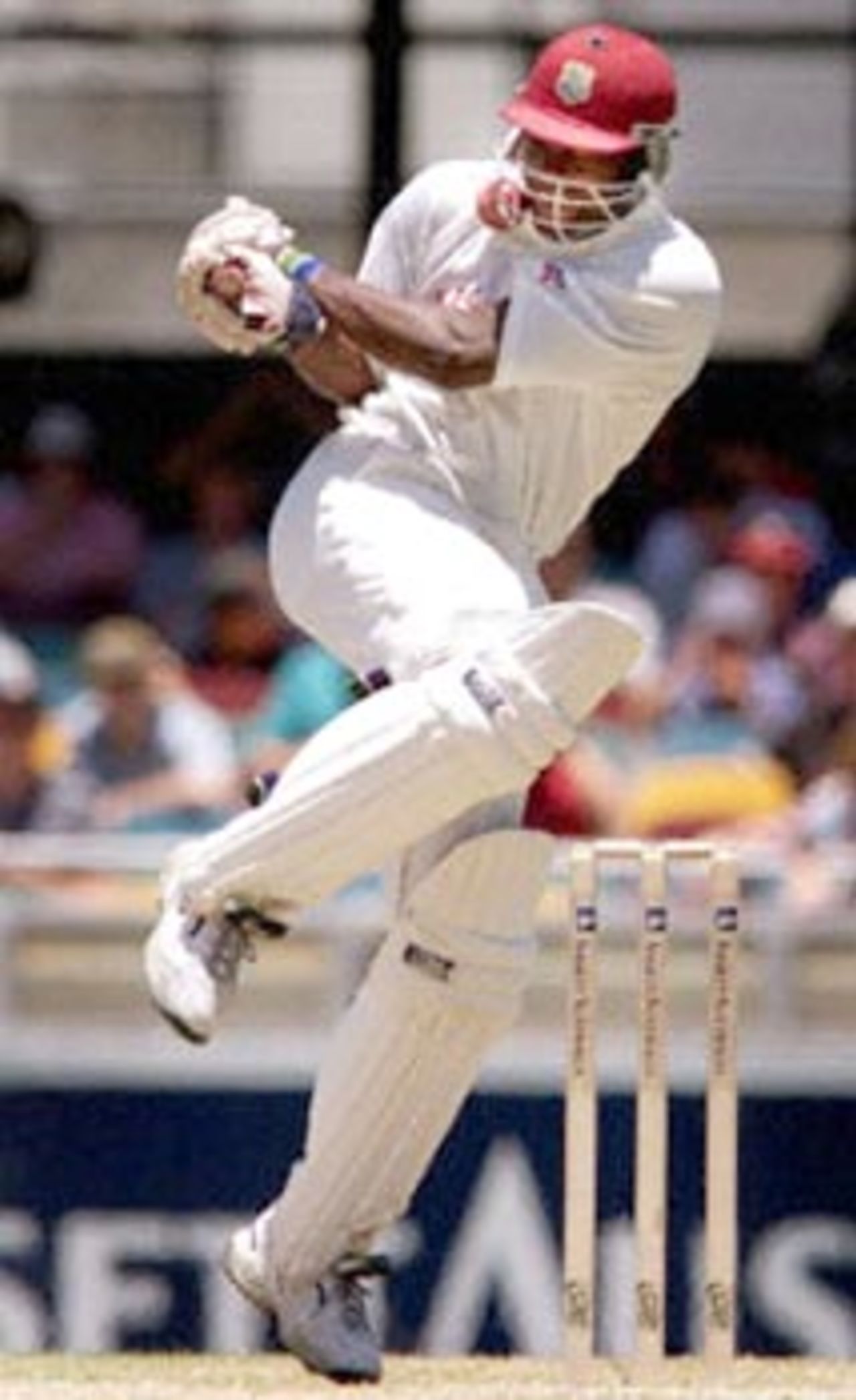 West Indian batsman Ridley Jacobs is hit in the face by a bouncer from Australian speedster  Brett Lee on the third day of the first Test match at the Gabba in Brisbane, 25 November 2000. At lunch the West Indies were struggling in their second innings at 81-6, still trailing Australia by 169 runs.