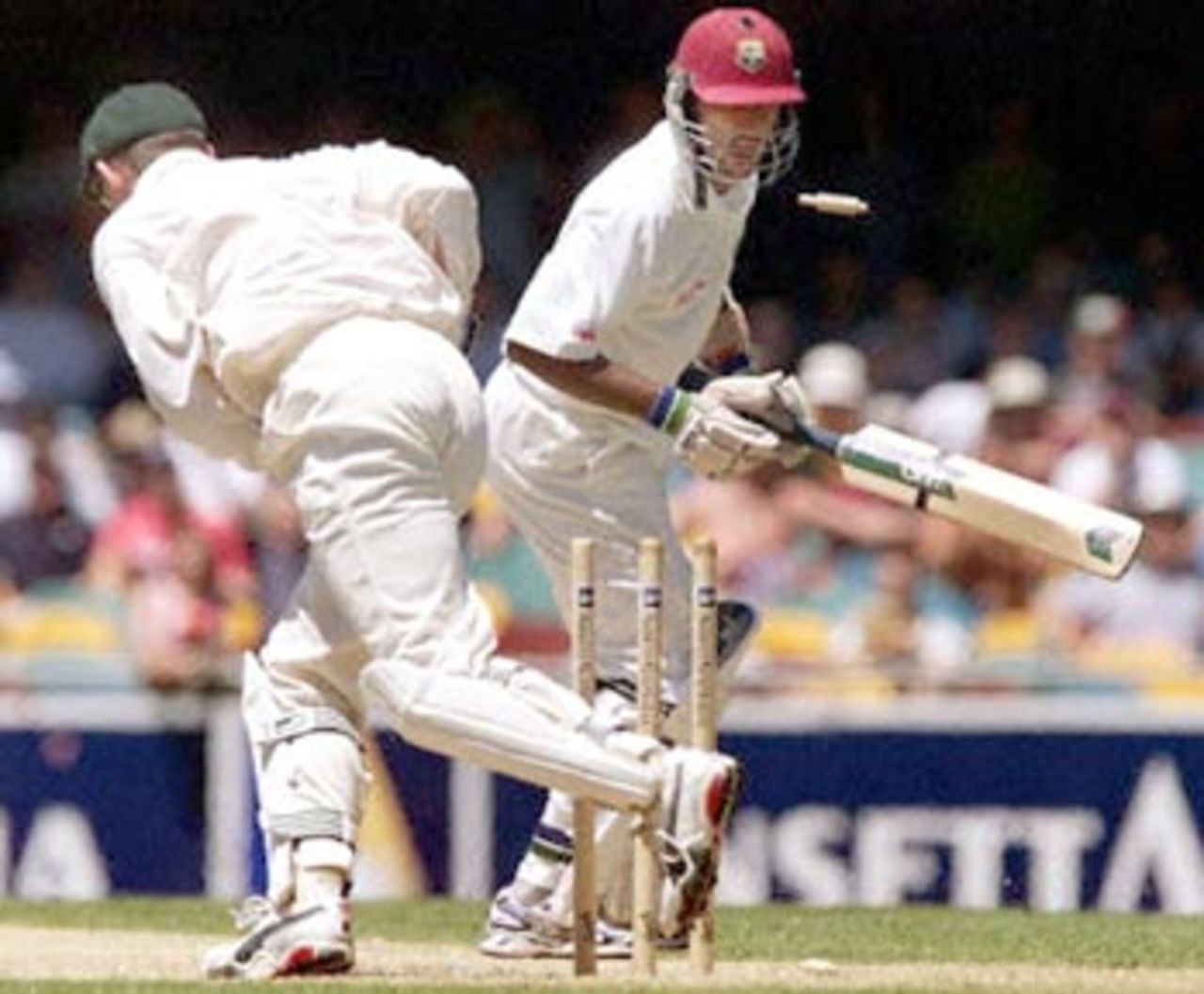 West Indian batsman Darren Ganga (R) turn to see Australian wicketkeeper Adam Gilchrist (L)  stumping him on the third day of the first Test match at the Gabba in Brisbane, 25 November  2000. At lunch the West Indies were struggling in their second innings at 81-6, still trailing  Australia by 169 runs.
