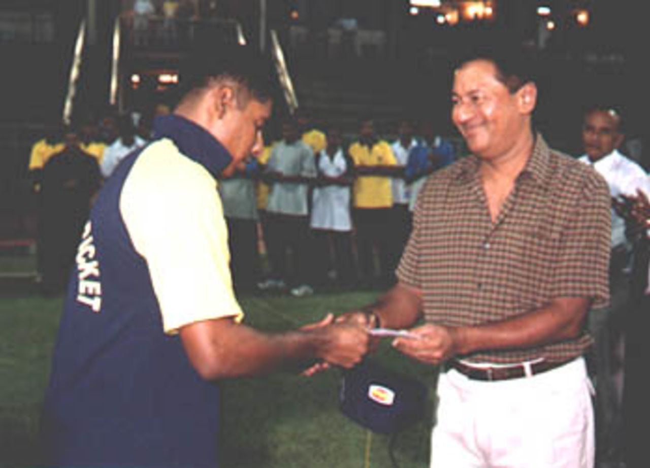 Chaminda Vass recieves Man of the match award, in the Premier Limited Over Tournament semi finals
