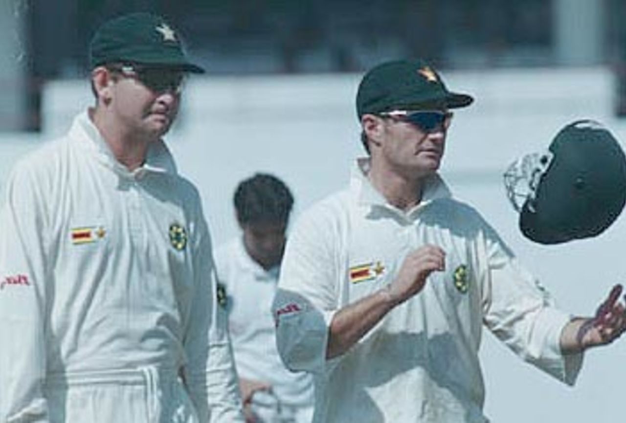 A morose looking Campbell and Guy Whittall on the field during the second test. Zimbabwe in India 2000/01, 2nd Test, India v Zimbabwe Vidarbha C.A. Ground, Nagpur, 25-29 November 2000 (Day 1)