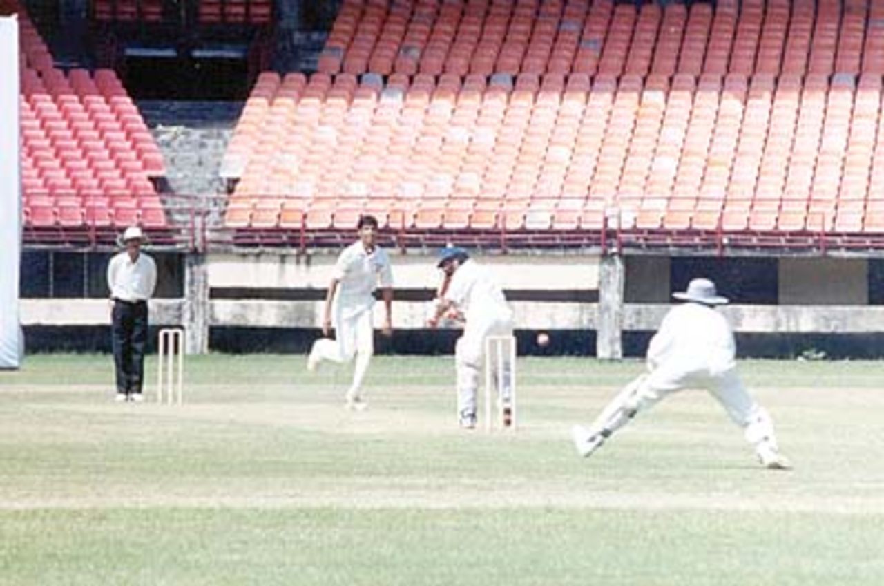 Dinesh Rao tries to flick the ball from Chandran, Ranji Trophy South Zone League, 2000/01, Kerala v Goa, Nehru Stadium, Kochi, 15-18 November 2000.