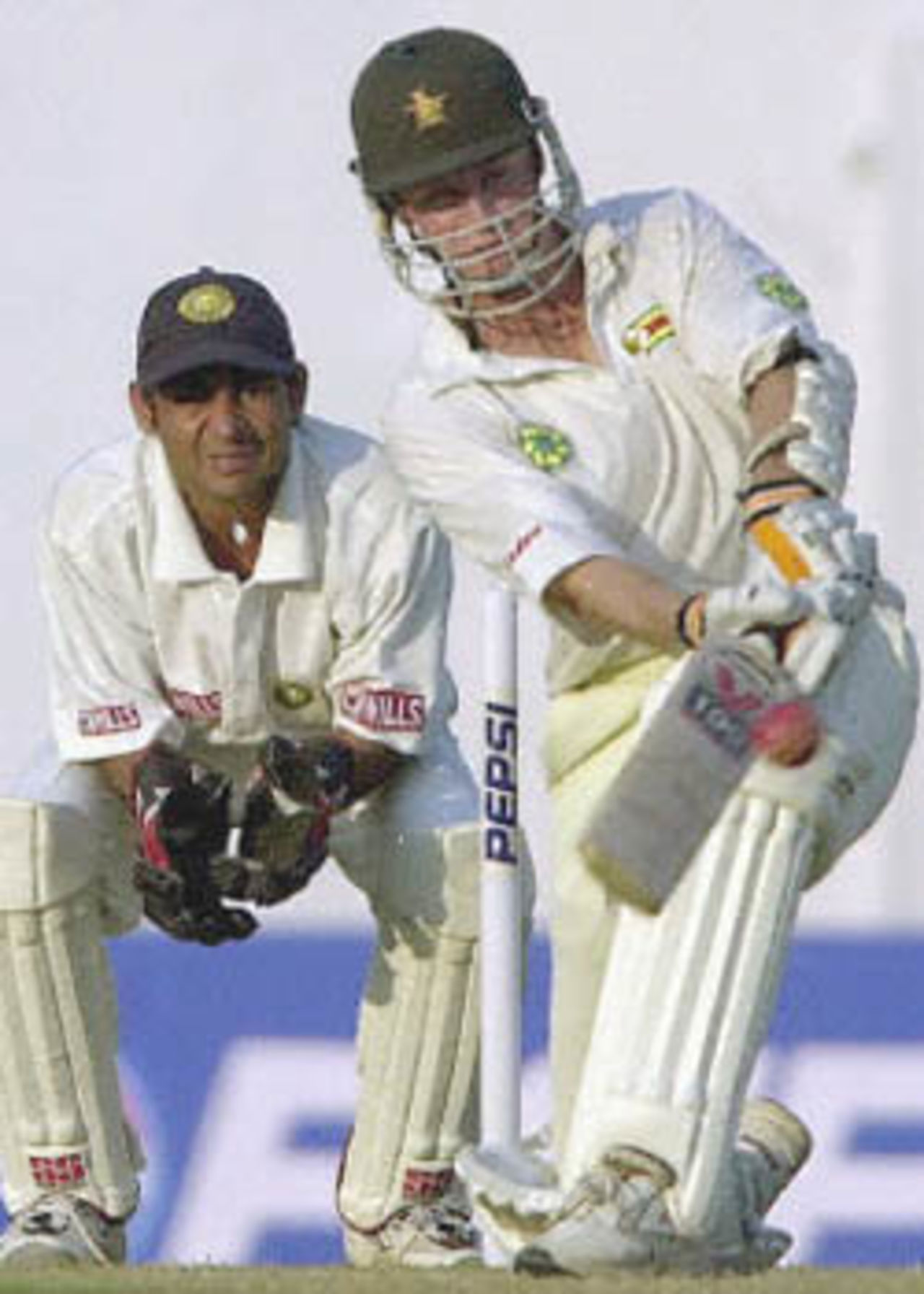 Grant Flower sweeps as Vijay Dahiya watches, Zimbabwe in India, 2000/01, 2nd Test, India v Zimbabwe, Vidarbha C.A. Ground, Nagpur, 25-29 November 2000 (Day 3).