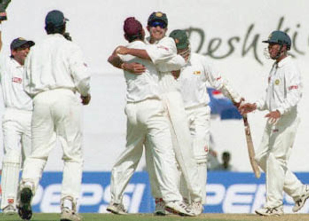 Sharandeep Singh being embraced by skipper Ganguly after he dismissed Guy Whittall, Zimbabwe in India, 2000/01, 2nd Test, India v Zimbabwe, Vidarbha C.A. Ground, Nagpur, 25-29 November 2000 (Day 3).