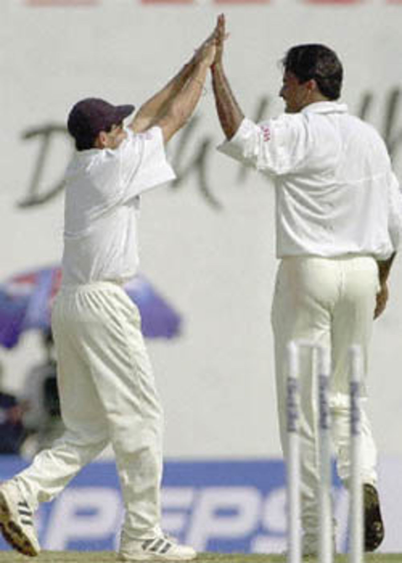 Agarkar congratulates Srinath after he bowled Olonga. Zimbabwe in India, 2000/01, 2nd Test, India v Zimbabwe, Vidarbha C.A. Ground, Nagpur, 25-29 November 2000 (Day 4).