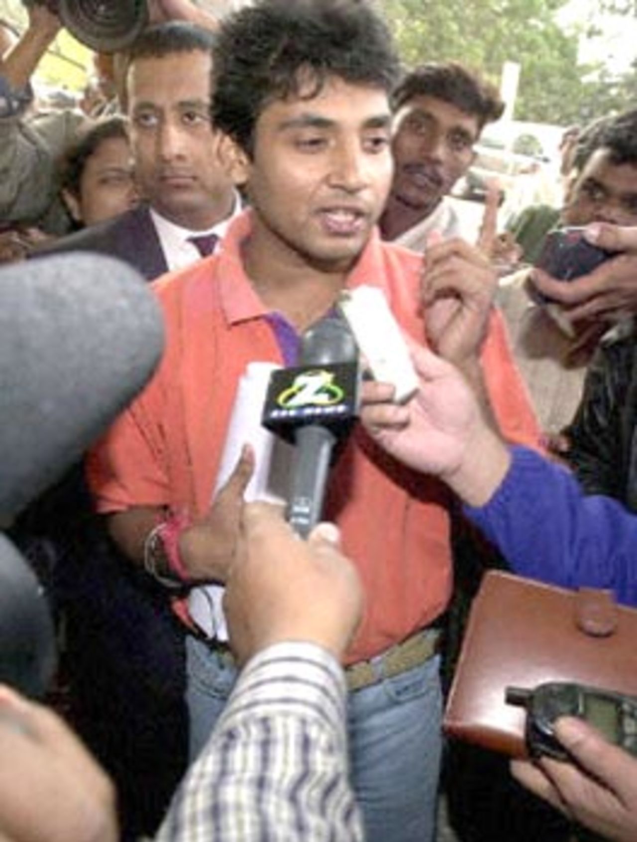 Indian cricket player Ajay Jadeja (C) speaks to reporters in front of the Taj Man Singh hotel  following a last hearing by cricket board officials 28 November 2000. Jadeja, along with former  skipper Mohhammad Azharuddin, could face a possible life ban for alleged match fixing.