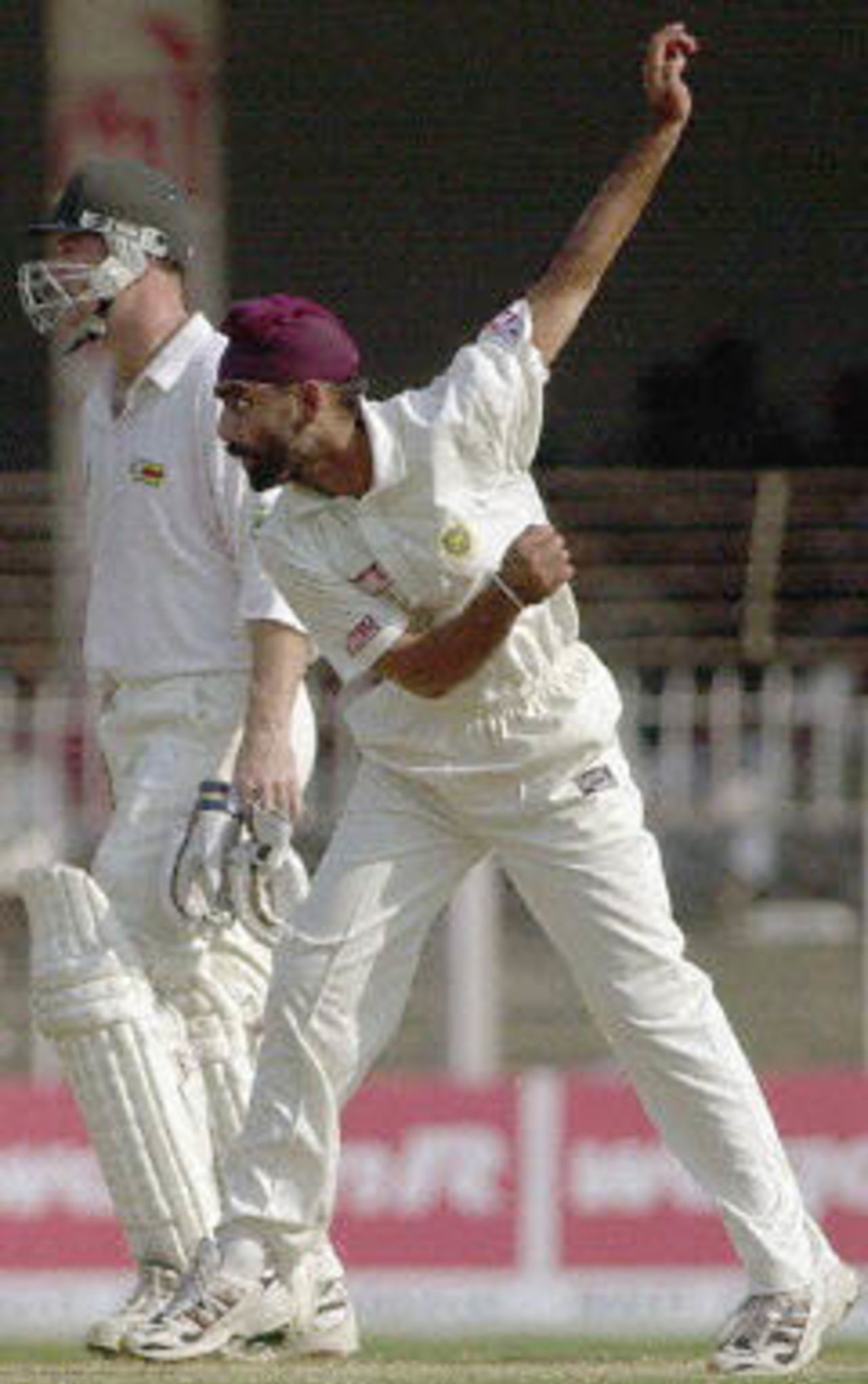 Debutant Sharandeep Singh bowls a delivery to Andy Flower as Campbell watches, Zimbabwe in India, 2000/01, 2nd Test, India v Zimbabwe, Vidarbha C.A. Ground, Nagpur, 25-29 November 2000 (Day 4).